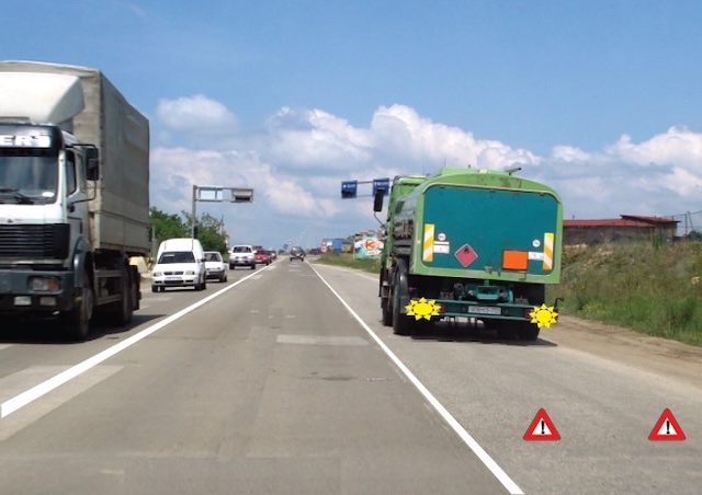 When should two safety triangles be placed, as in the photo?