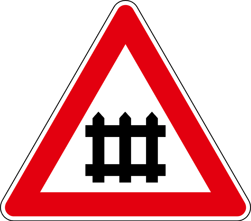 The traffic sign warns of the proximity of the railway crossing with the terminus.