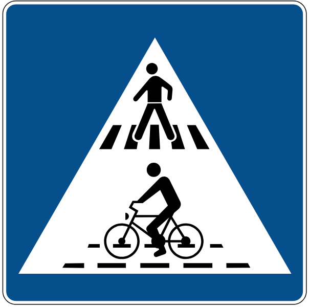The traffic sign indicates a pedestrian and bicycle crossing.