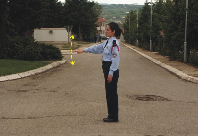 What does the police officer's position indicate?