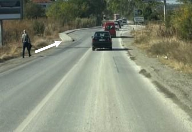 The pedestrian outside the settlement is moving straight, on the left side of the road in the direction of movement.