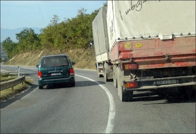 Overtaking is allowed in this situation, if the truck moves too slowly.