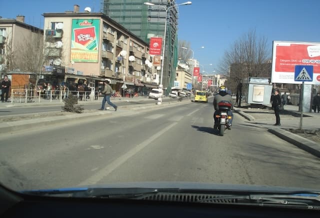 It is allowed to overtake the motorcycle in this situation.