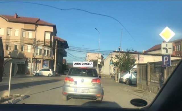 In this situation, I will be careful in the safety distance to the Auto School car.