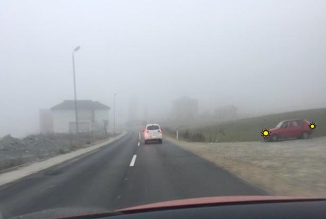 The right vehicle has signaled for a left turn, you must give  priority to passing as it is coming from the right side.