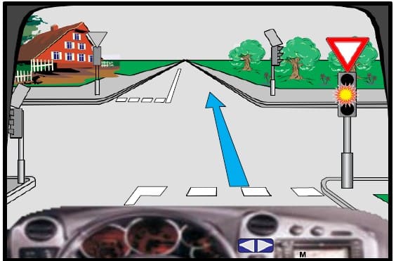 The flashing yellow light is on at the traffic light (intermittently), in this situation, I must stop before the traffic sign.