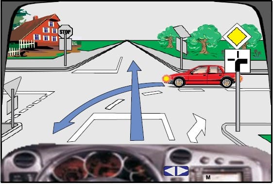 At this intersection I move behind the red car.